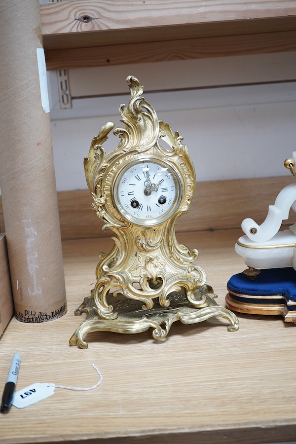 A late 19th century French ormolu mantel clock and another clock in an alabaster case, 39cm. Condition - fair to good